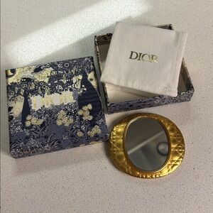 Vintage Christian Dior gold plated mirror.